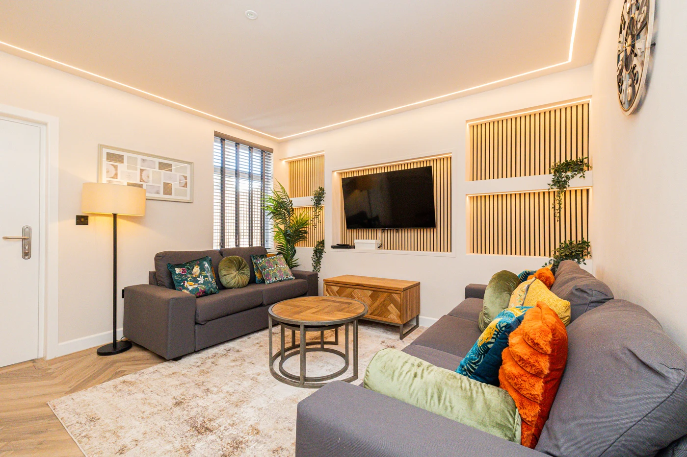 A warm, high-quality Bright Futures lounge with comfortable sofas and colourful cushions